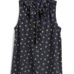 Stitch Fix women’s navy tie-neck blouse with green and yellow floral print.