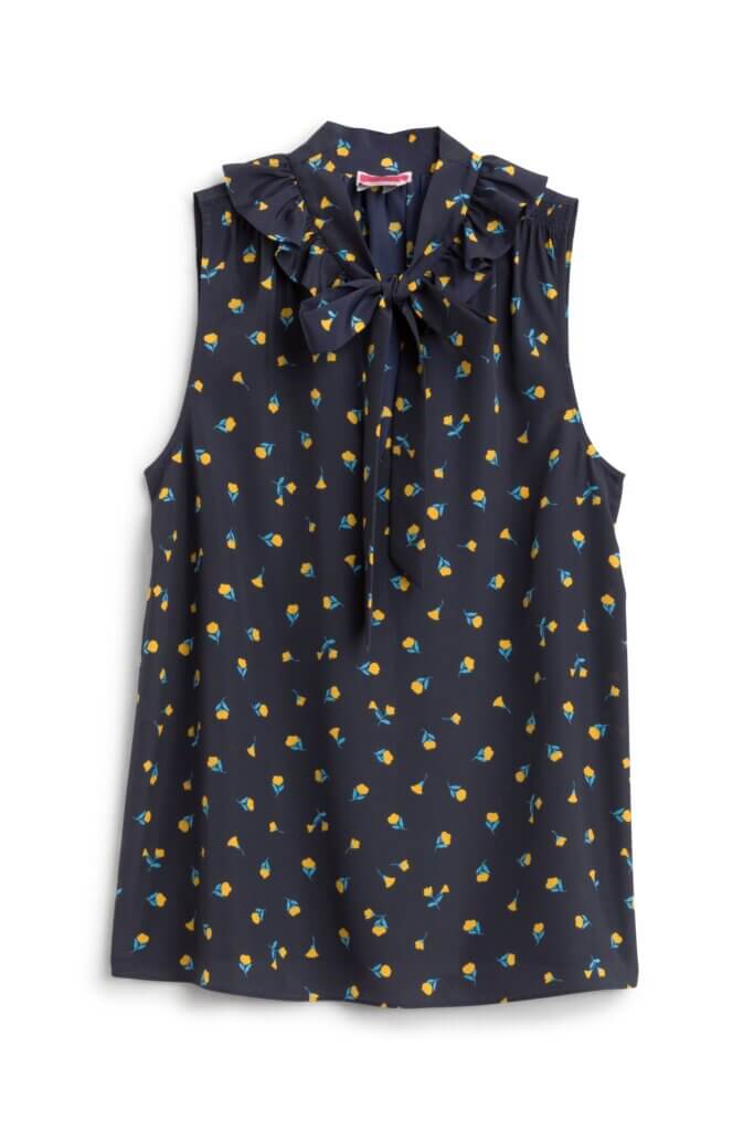 Stitch Fix women’s navy tie-neck blouse with green and yellow floral print.