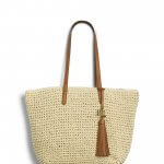 Stitch Fix women’s cream woven tote bag with brown leather handle and tassel.