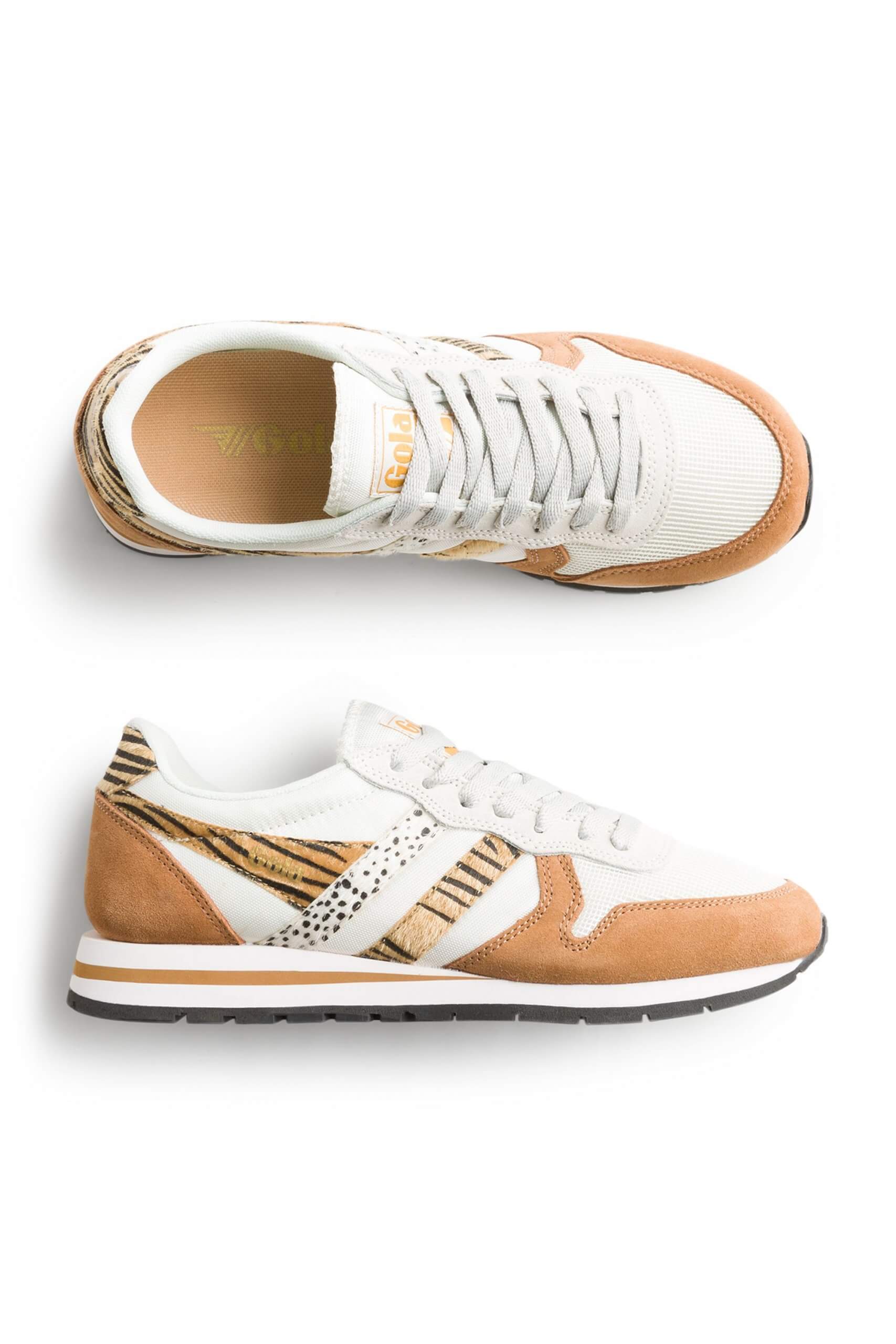 Stitch Fix women’s white and brown sneakers with animal print stripes and white laces.