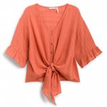 Stitch Fix women’s cropped orange short-sleeve shirt with buttons and tie front.