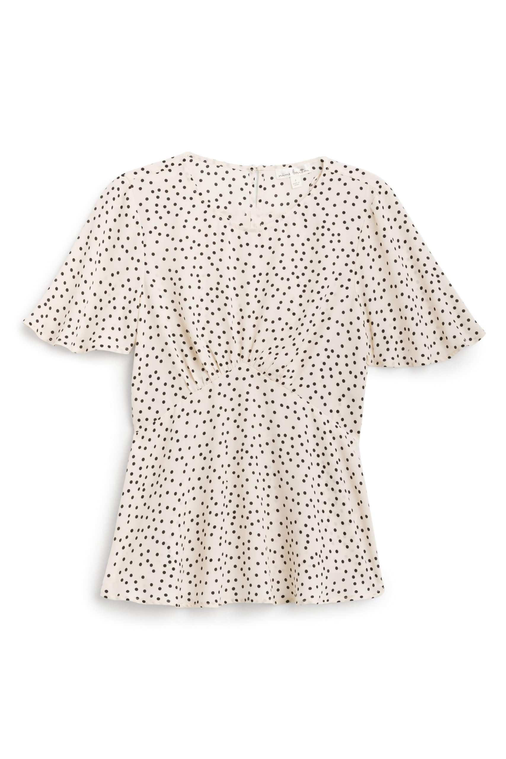 Stitch Fix women’s cream and black polka-dot blouse with flutter sleeves and cinched waist.