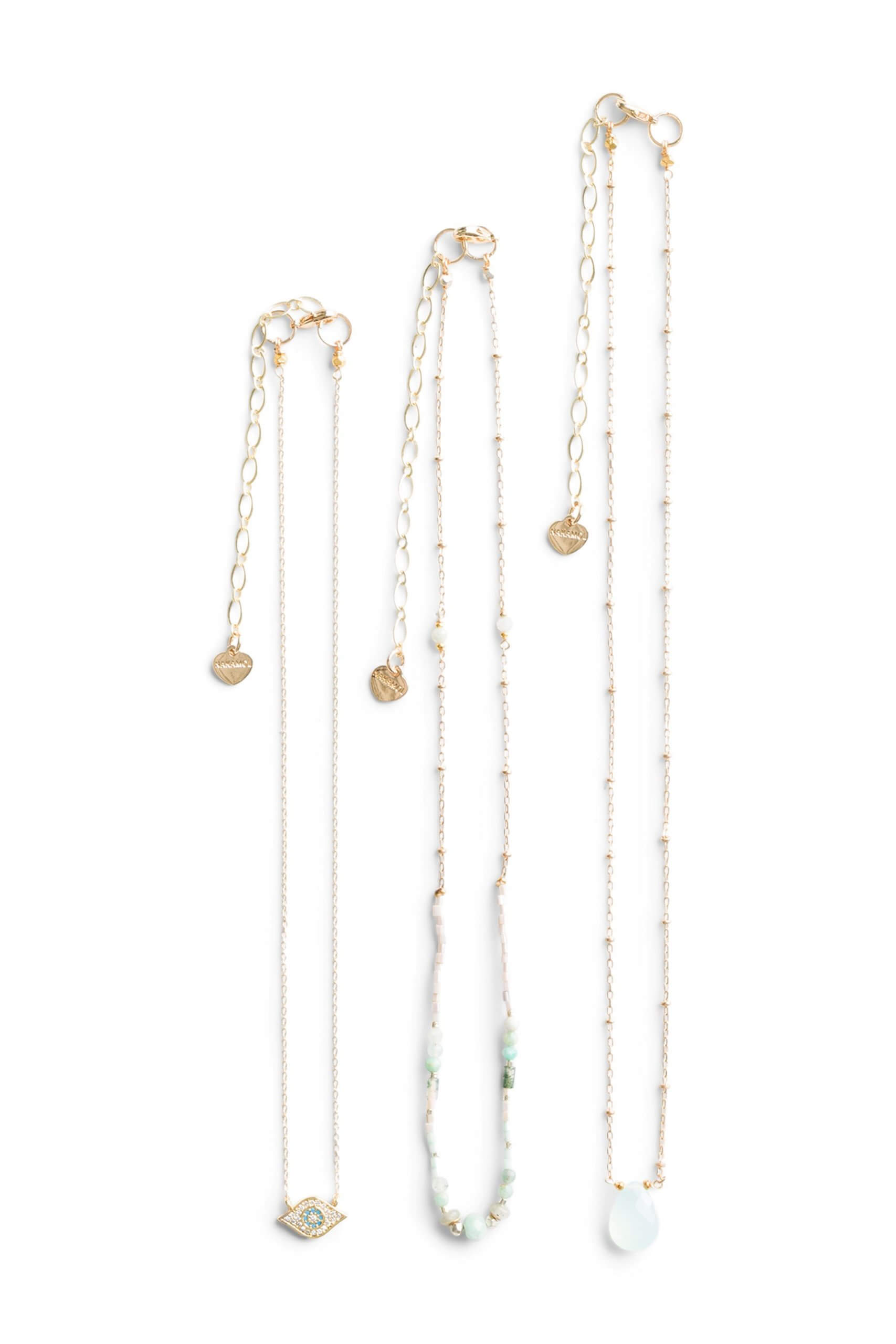 Stitch Fix Women's three-piece necklace set with gold chains and light blue beads.