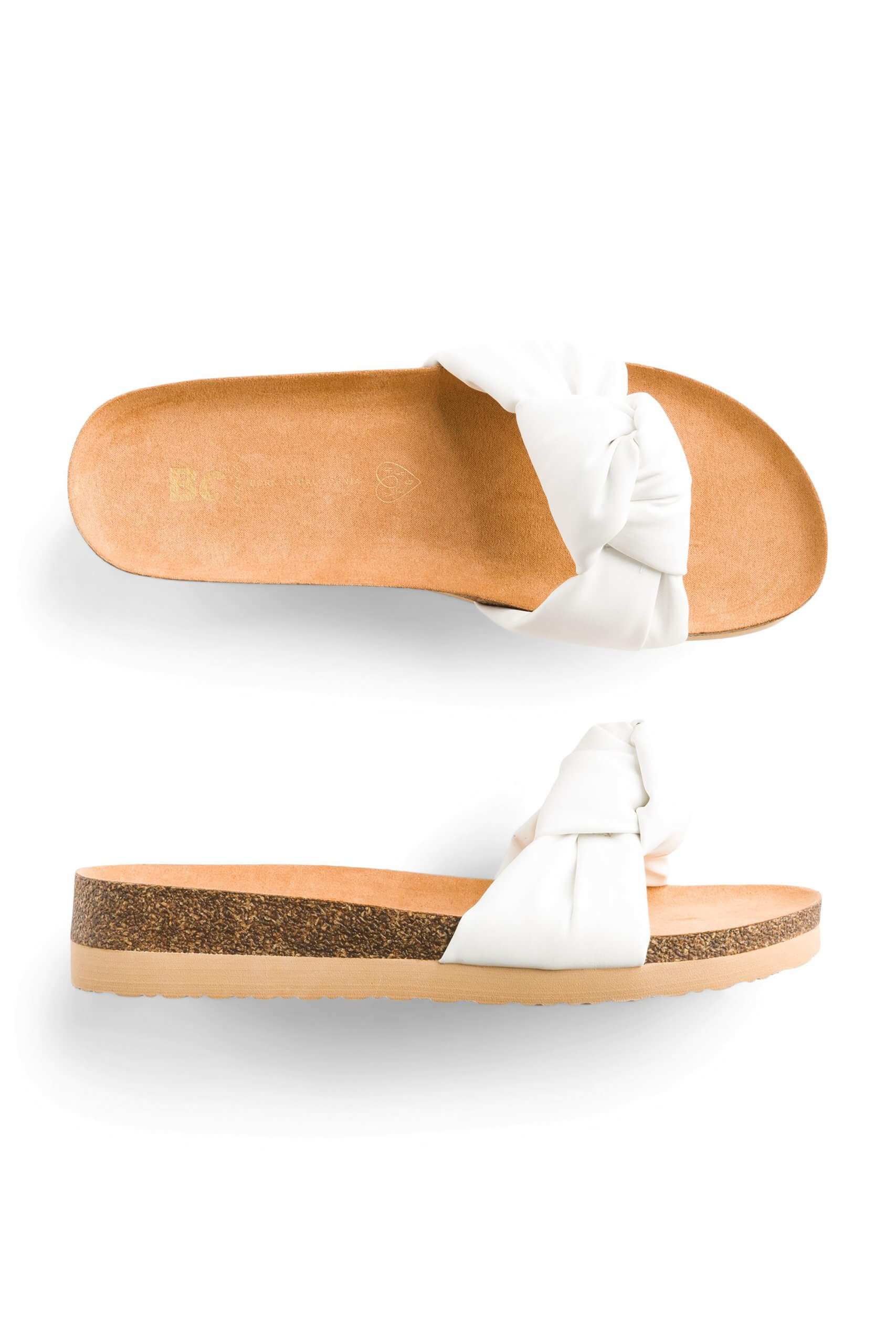 Stitch Fix women’s white sandals with a knot detail and cork platform.