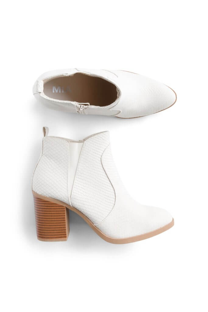 Stitch Fix women’s white heeled ankle booties.
