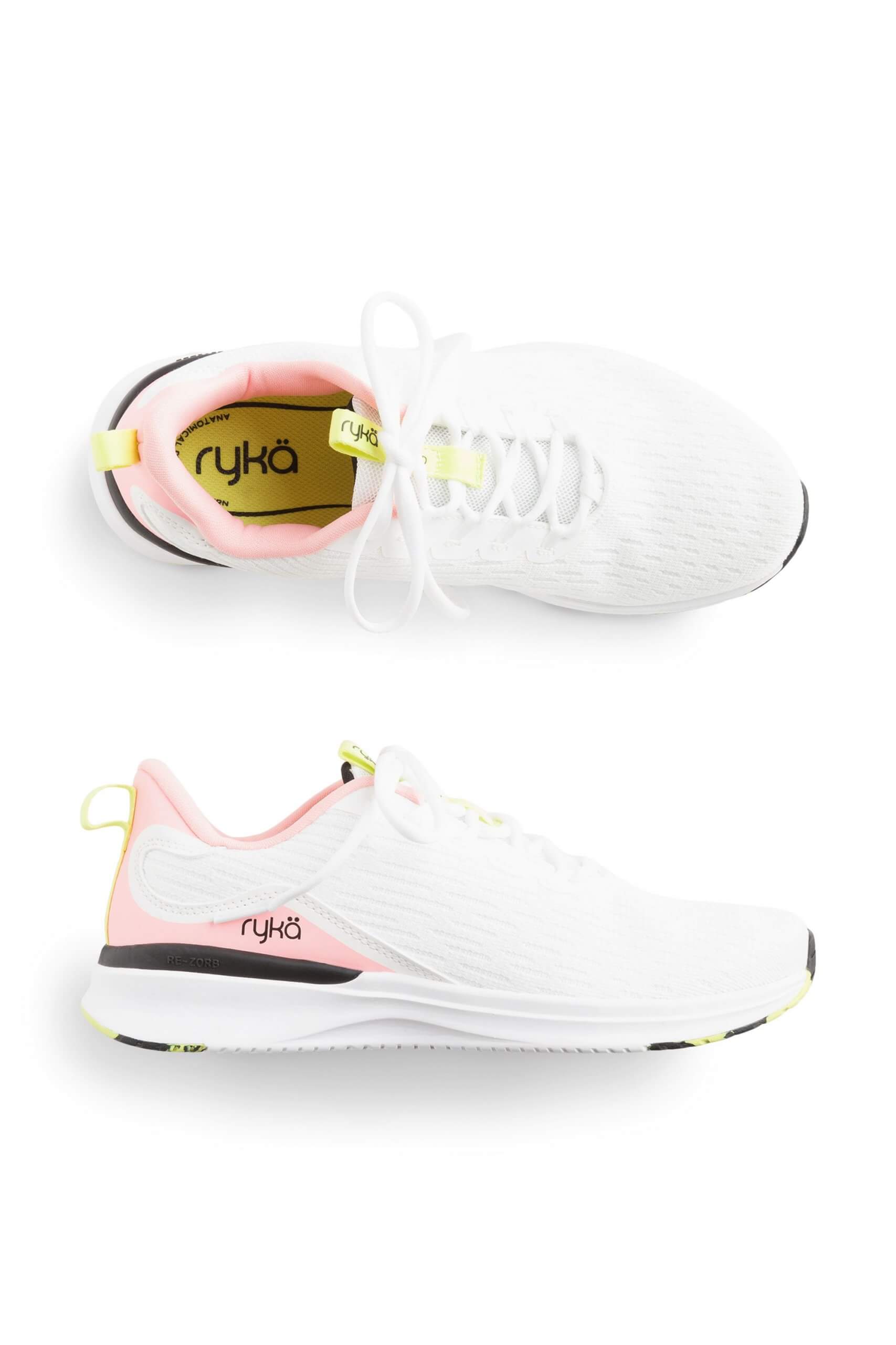 Stitch Fix women’s pink and black accented white sneakers.