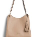 Stitch Fix women’s blush leather tote bag with tassel and silver hardware.