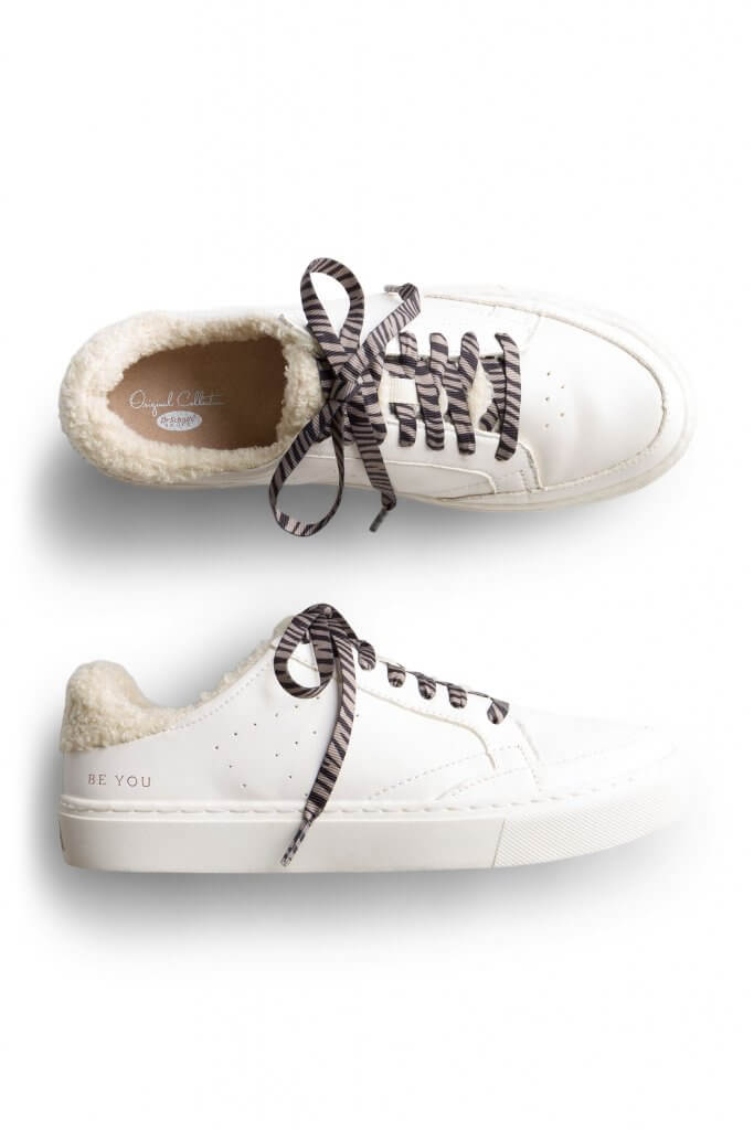 Stitch Fix women’s white sneakers with bouclé lining and grey zebra striped laces.