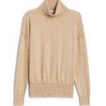 Stitch Fix women’s tan fitted turtleneck sweater with drop shoulders.