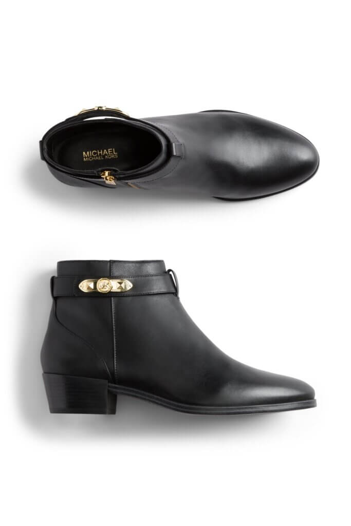 Stitch Fix women’s black ankle boots with gold trim detail.