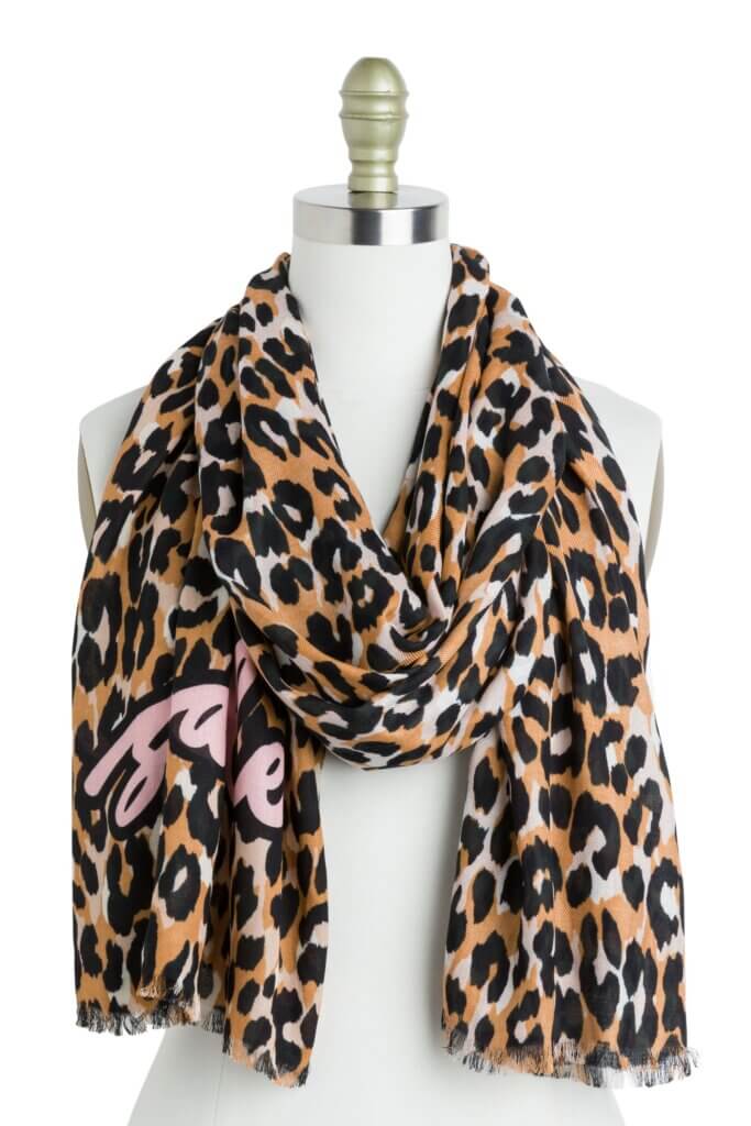 Stitch Fix women’s black, white and brown leopard print scarf with pink graphic on bust form.