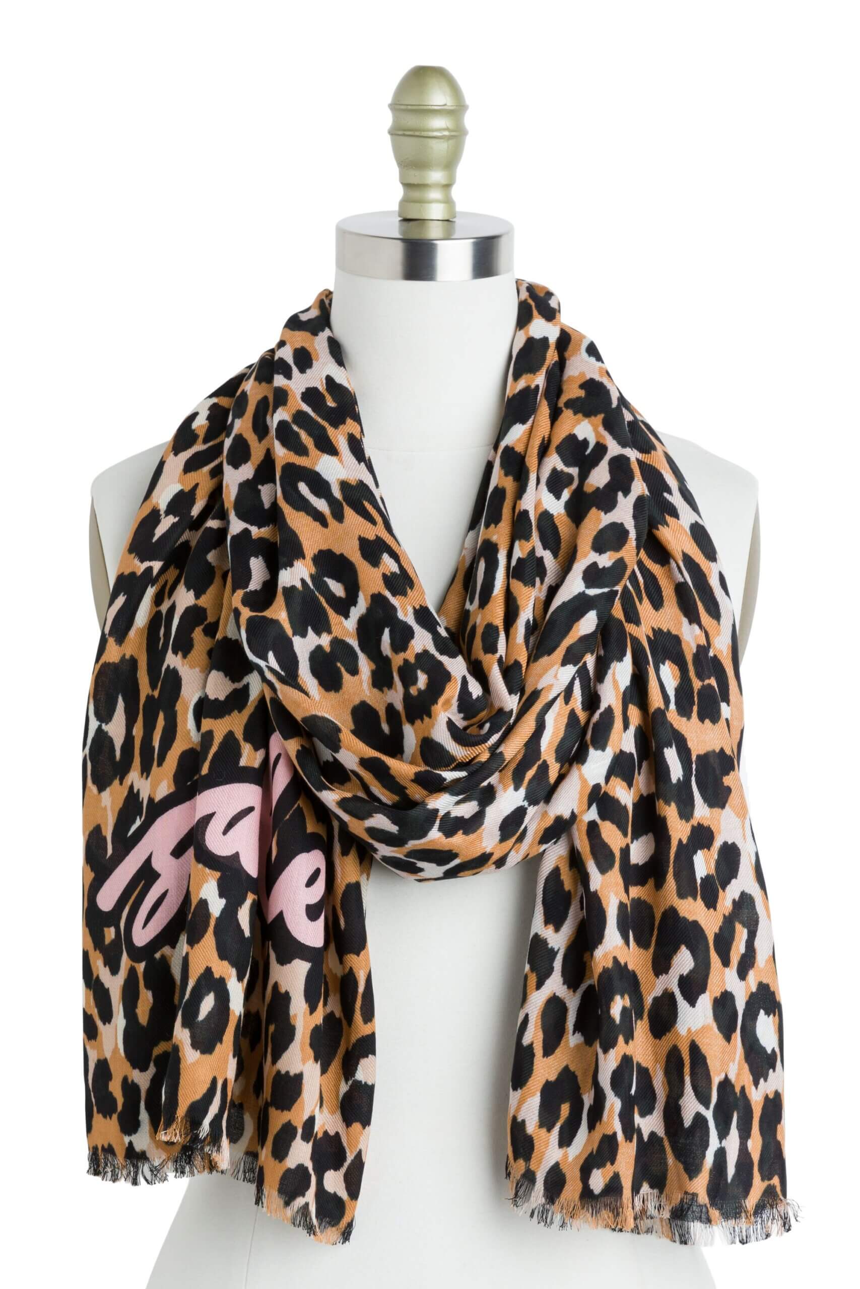 Stitch Fix women’s black, white and brown leopard print scarf with pink graphic on bust form.