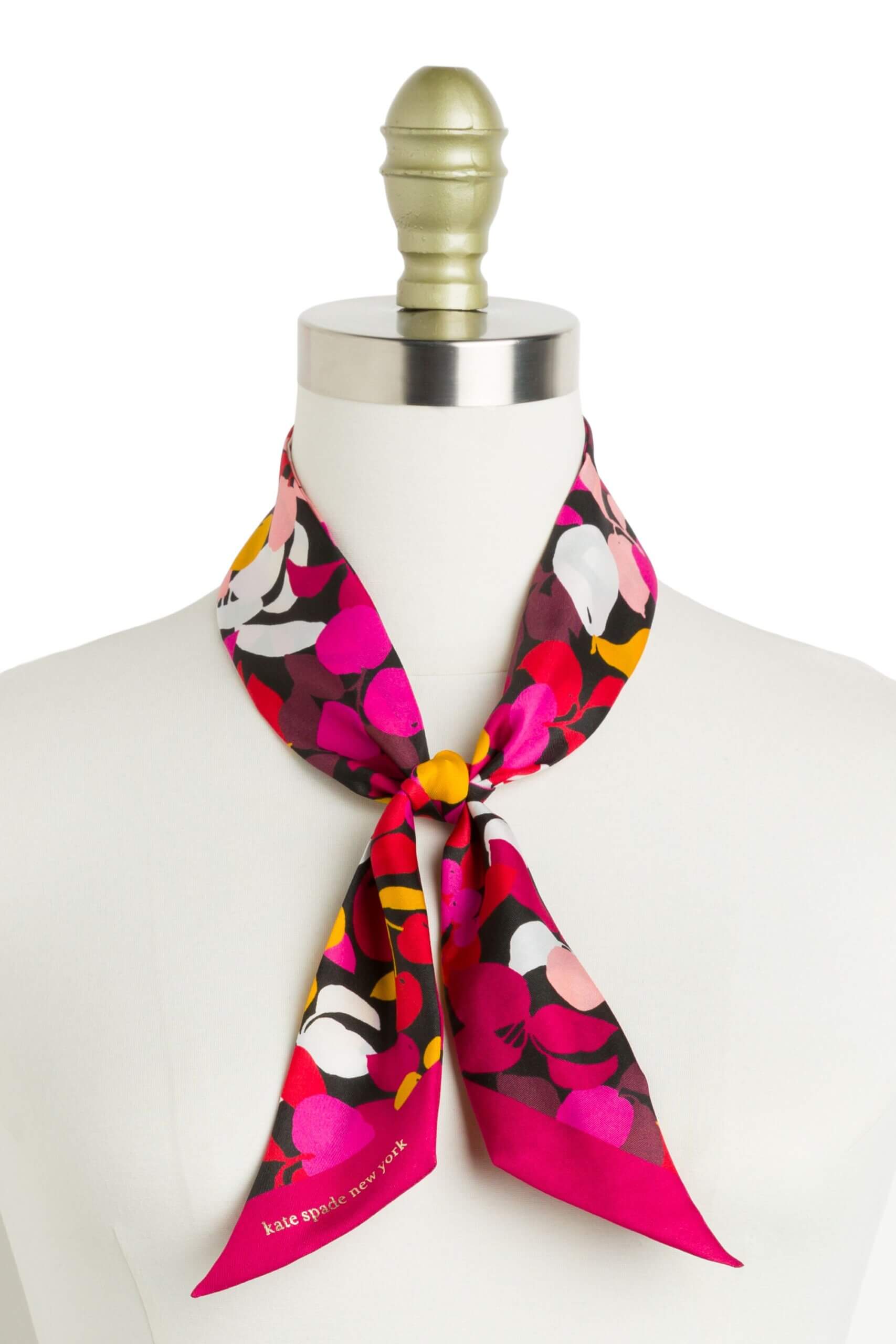 Stitch Fix women’s pink, black, green and white floral silk scarf tied around neck of bust form.