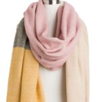 Stitch Fix women’s yellow, light pink, off-white and green color-block blanket scarf with fringe ends on bust form.