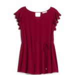 Stitch Fix women’s dark red maternity blouse with tie at waist and eyelet ruffle cap sleeves.