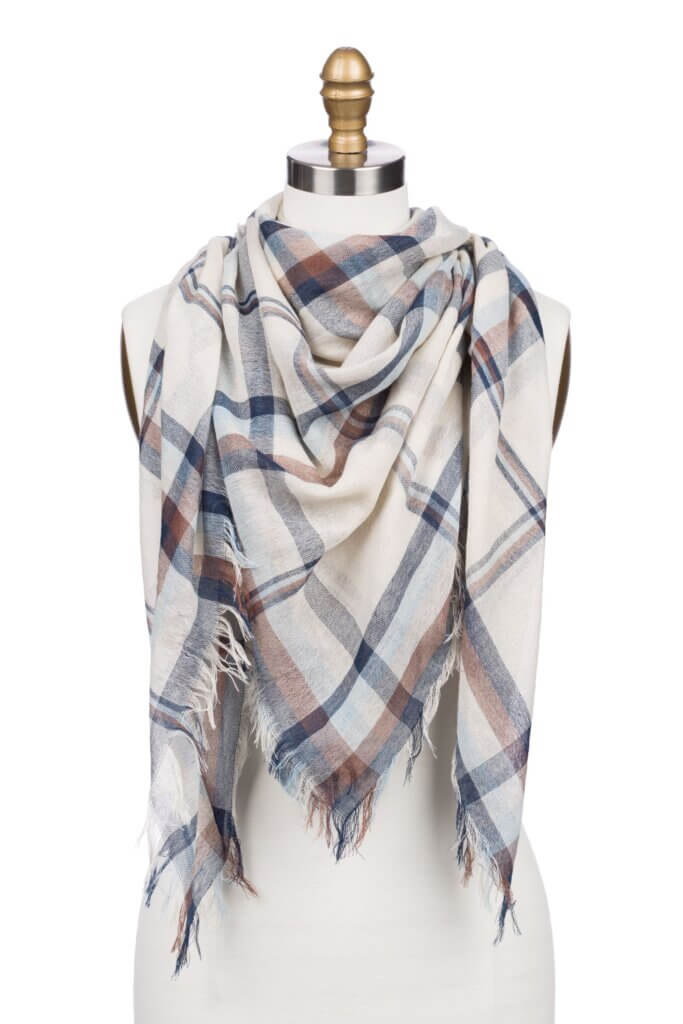 Stitch Fix women’s white, navy and burgundy plaid blanket scarf with fringe ends on bust form.