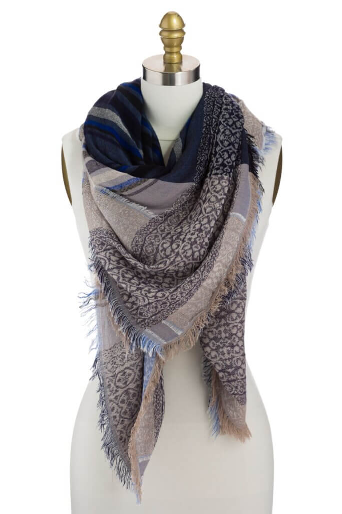 Stitch Fix women’s blue and tan blanket scarf with fringe ends on bust form.