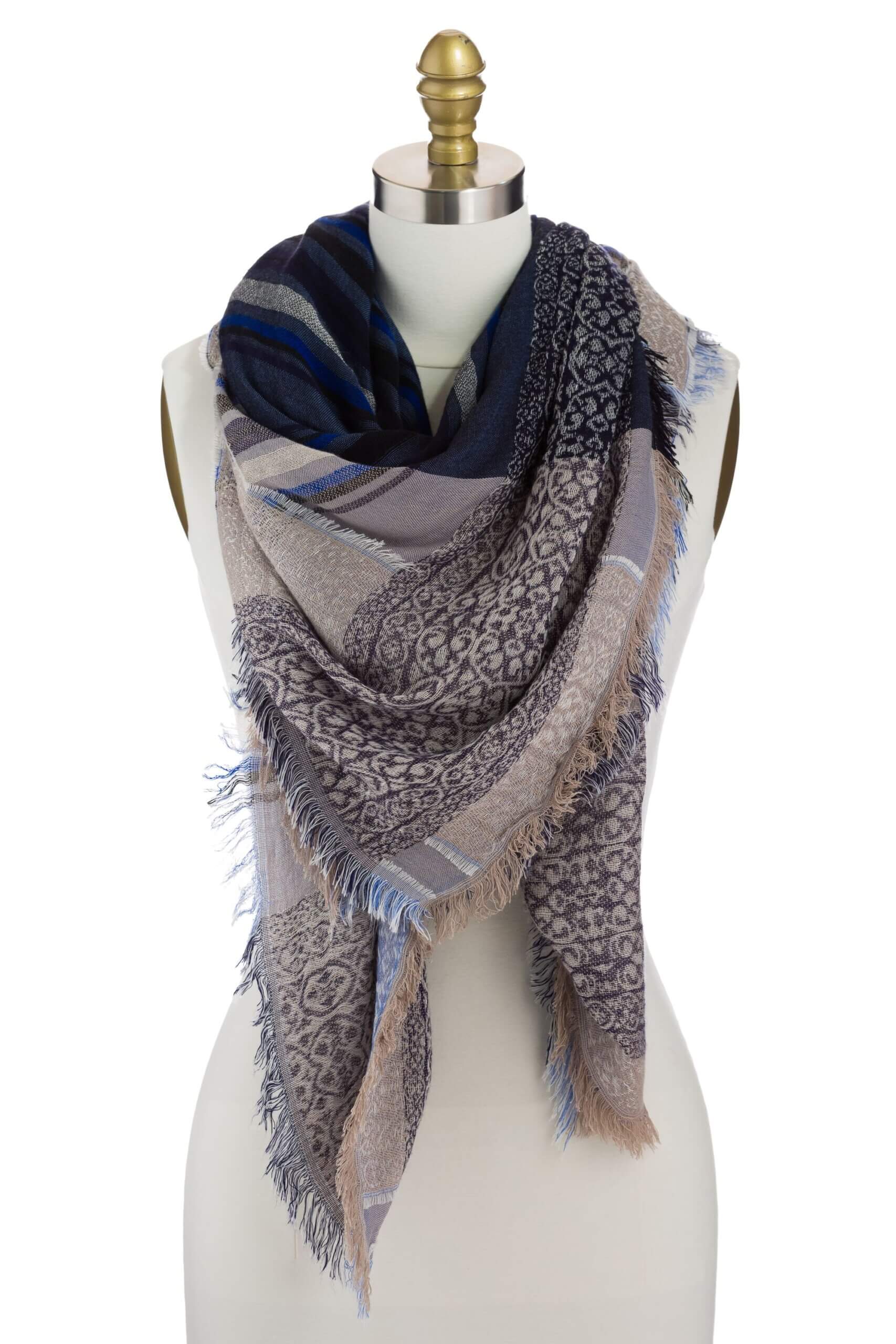 Stitch Fix women’s blue and tan blanket scarf with fringe ends on bust form.