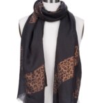 Stitch Fix women's black and leopard print color block woven scarf on bust form.