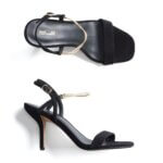 Stitch Fix women’s black strappy heels with gold accents.