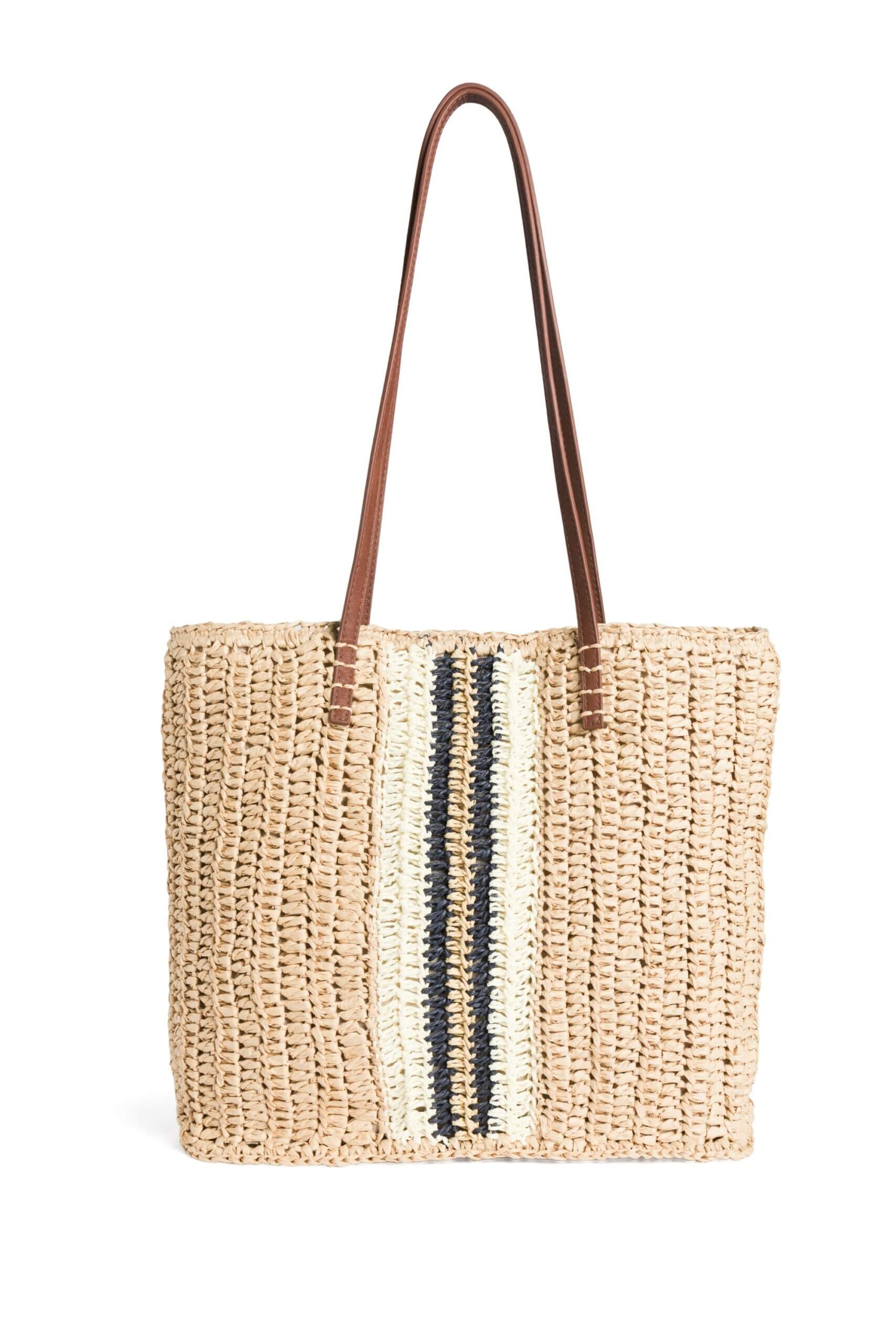 Stitch Fix women’s tan straw tote bag with black and white stripes down the middle.