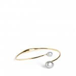 Stitch Fix women’s gold bangle bracelet with pearl accents.