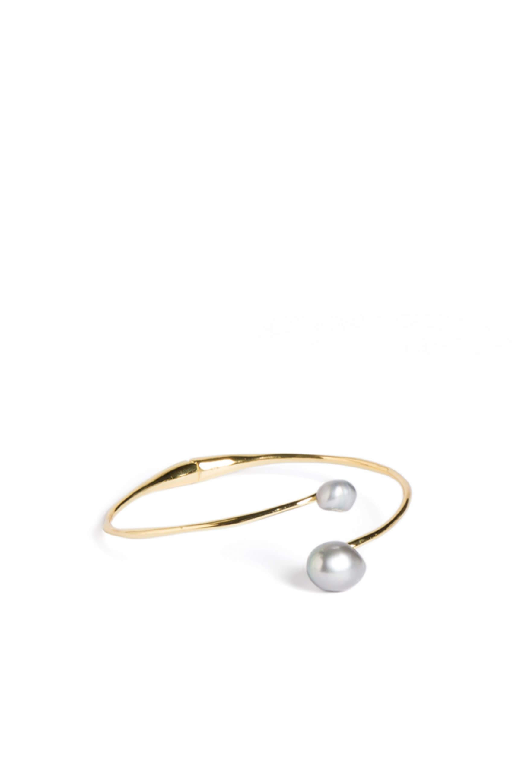 Stitch Fix women’s gold bangle bracelet with pearl accents.