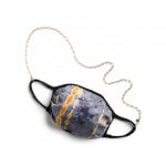 Stitch Fix Women’s mask in navy and orange tie-dye with delicate gold chain necklace.