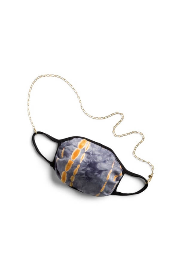 Stitch Fix Women’s mask in navy and orange tie-dye with delicate gold chain necklace.