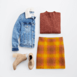 Stitch Fix Women’s cozy fall aesthetic outfit with denim jacket, burgundy sweater, mustard plaid miniskirt and tan boots.