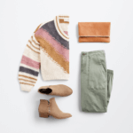 Stitch Fix Women’s cozy fall aesthetic outfit with multi-colored v-neck sweater, olive cargo pants, brown boots and brown clutch.