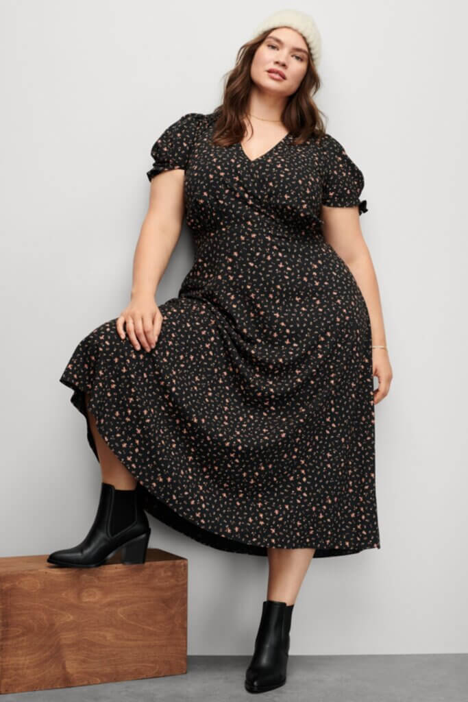 Stitch Fix Women’s model wearing a grunge style outfit with a midi dress, booties and beanie.