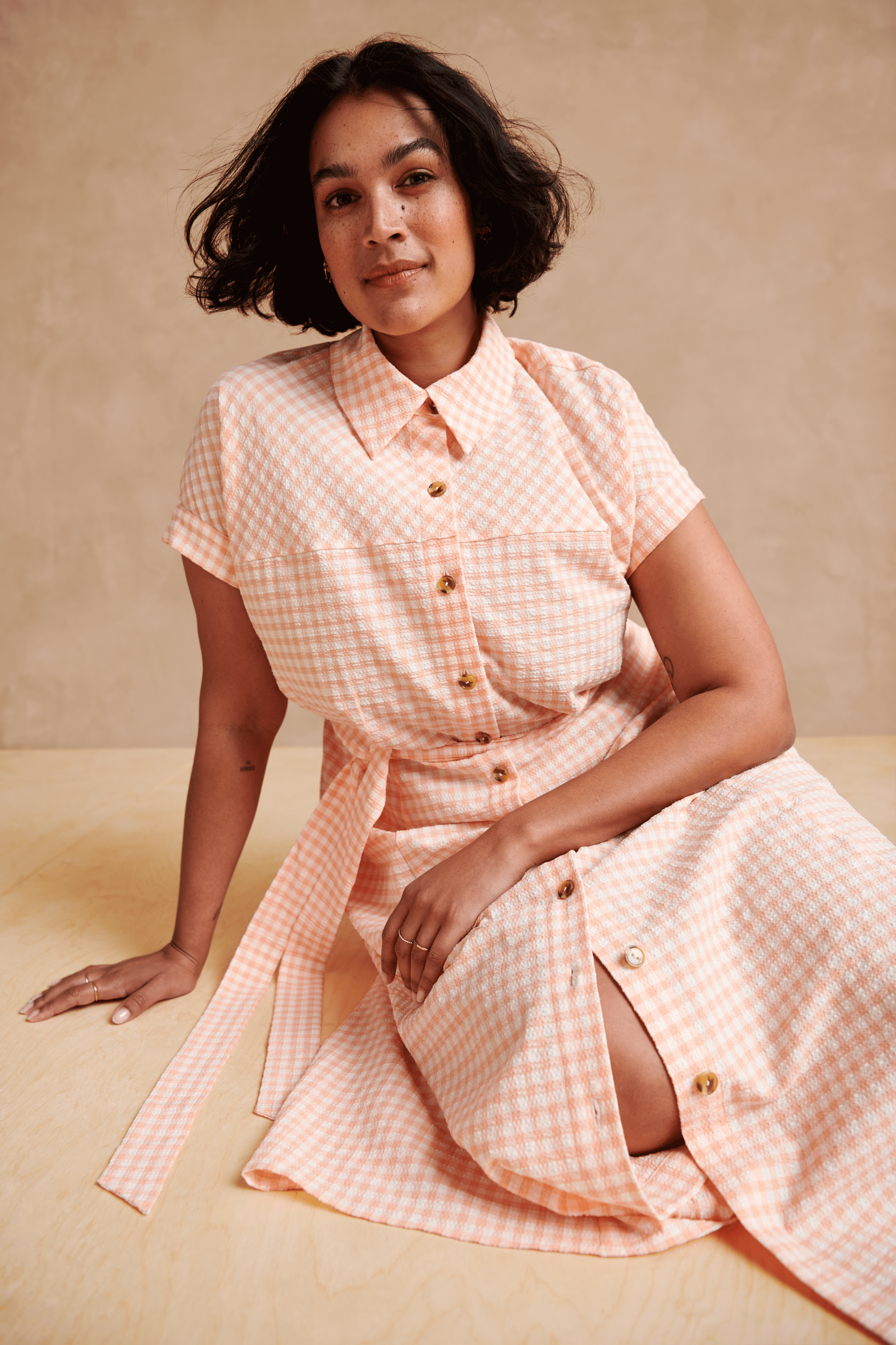 Stitch Fix model wearing women’s cottagecore aesthetic outfit with pink and white plaid collared dress.