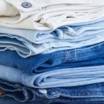 Stitch Fix Women’s stack of blue and white straight-leg jeans.