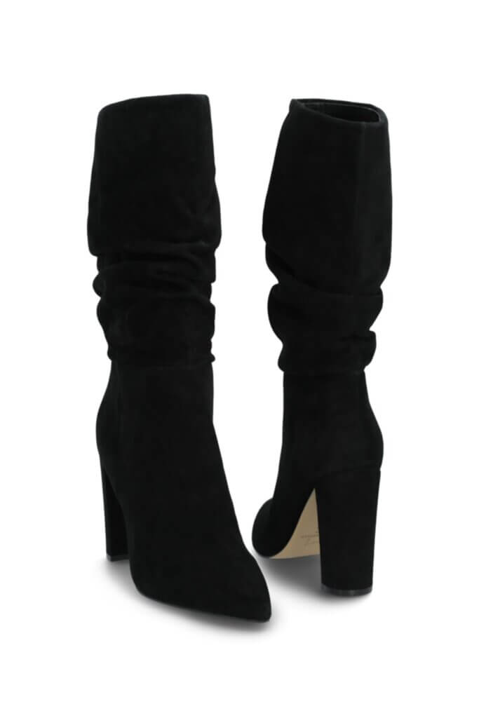 Stitch Fix Women’s black knee-high heeled boots.