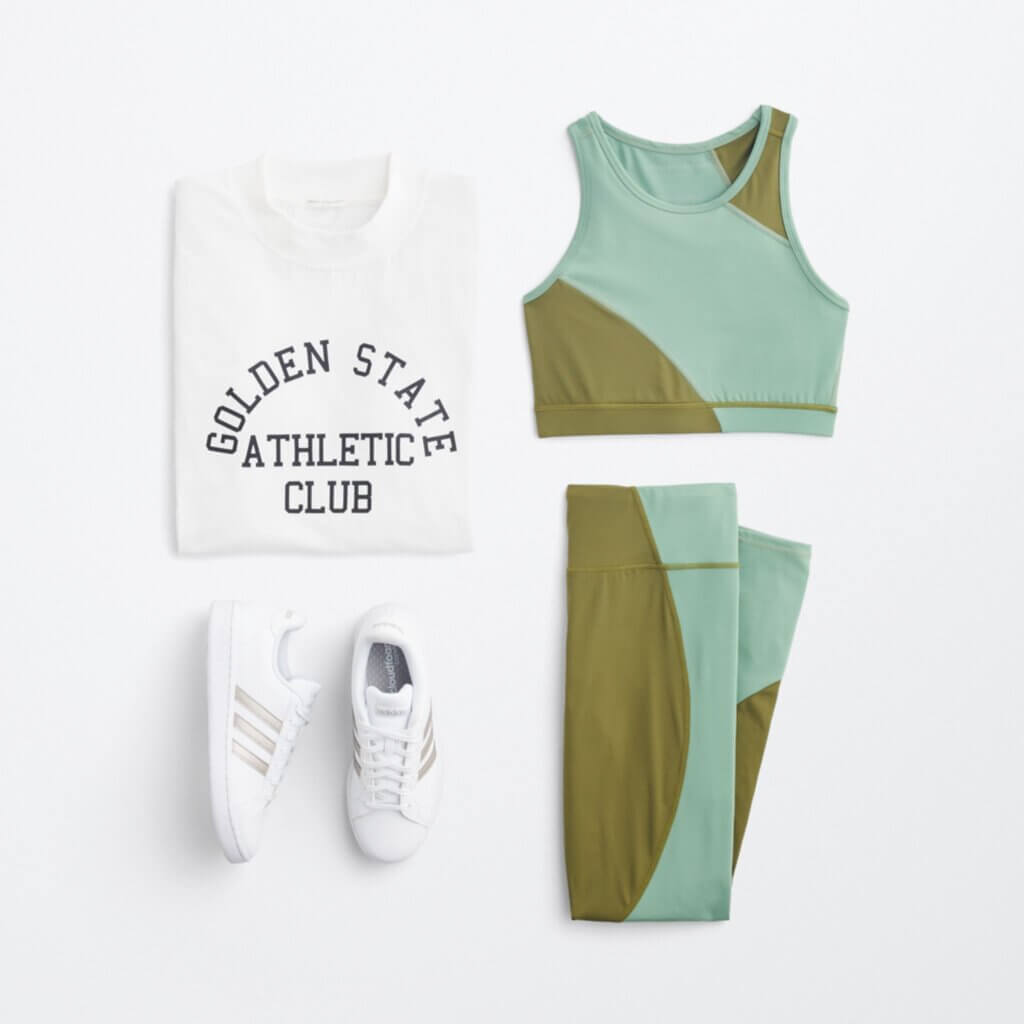 Stitch Fix Women’s collegiate fashion outfit with matching leggings and sports bra, crew neck athletic shirt and sneakers.