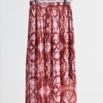Stitch Fix women’s printed pleated midi skirt hanging from clothes rack.