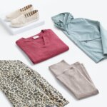 Stitch Fix women’s hiking outfit with leopard-print sweatshirt, burgundy knit top, brown leggings, olive jacket and white slip-on sneakers.