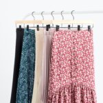 Stitch Fix women’s skirts in different prints and colors hanging on a rack.