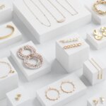 Stitch Fix women’s array of accessories to pair with a navy blue dress for a wedding with earrings, necklaces, hair clips.