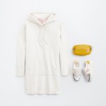 Stitch Fix women’s little white dress outfit with white long-sleeve athleisure dress, mustard hip pack and colorful sneakers.