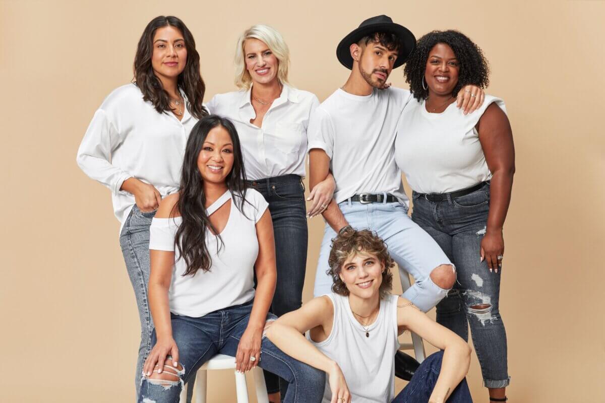 Stitch Fix stylists wearing white tops and blue jeans.