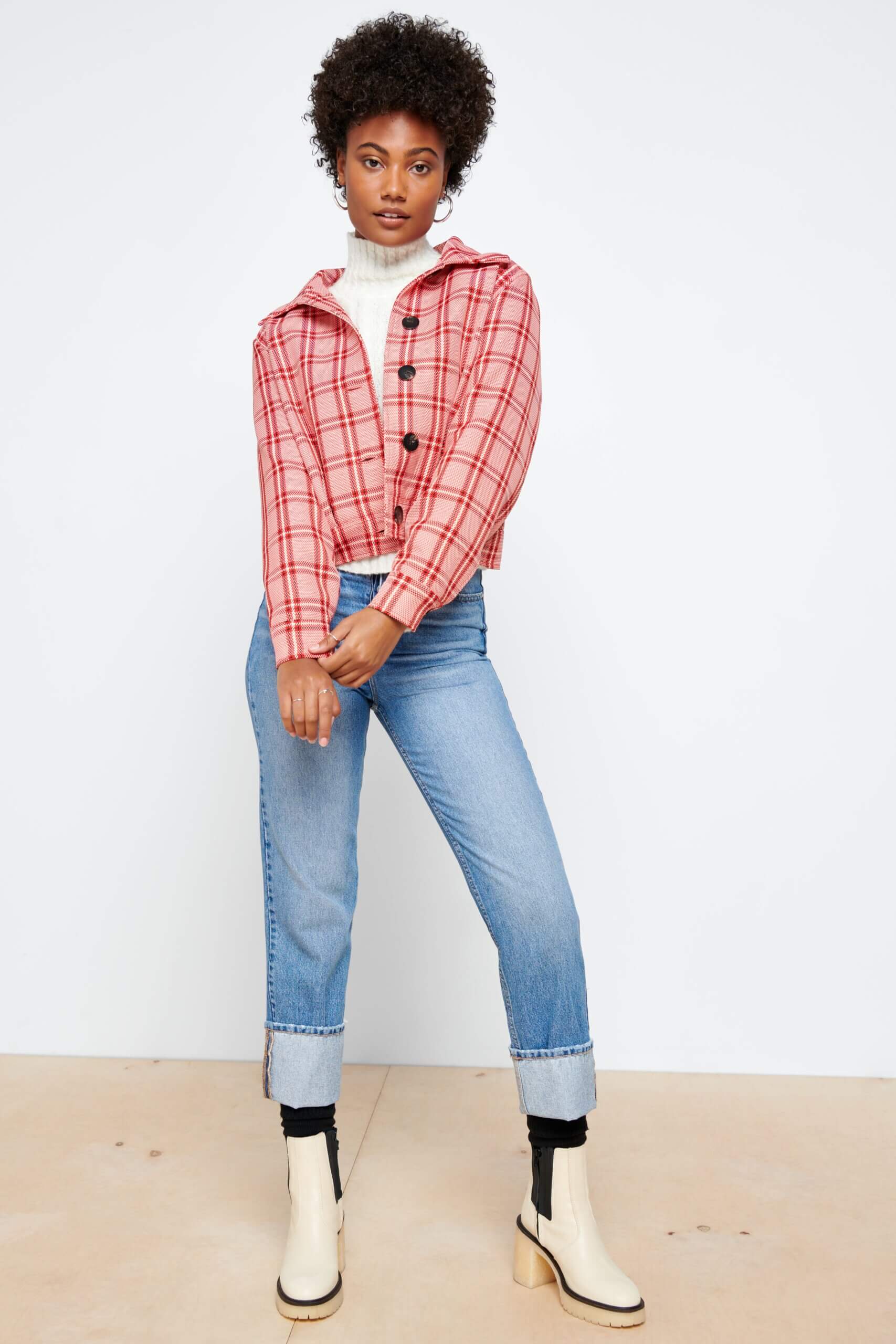 Stitch Fix's outfit idea for what to wear on Valentine's Day on model wearing plaid jacket and jeans.