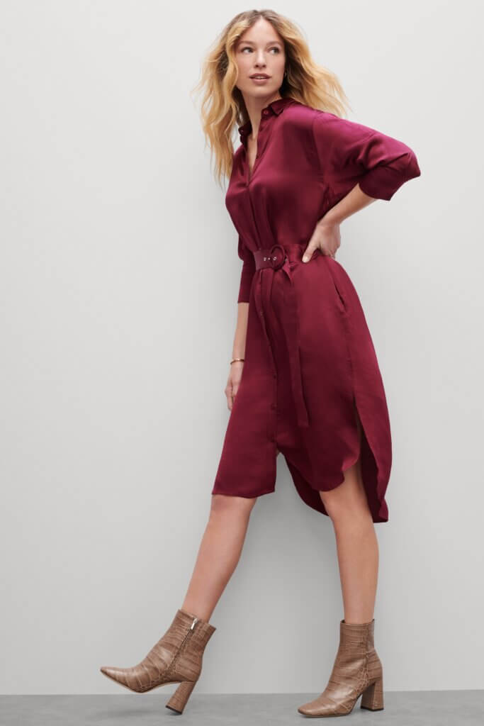 Stitch Fix women’s model wearing burgundy three-quarter sleeve shirt dress and light brown heeled booties.