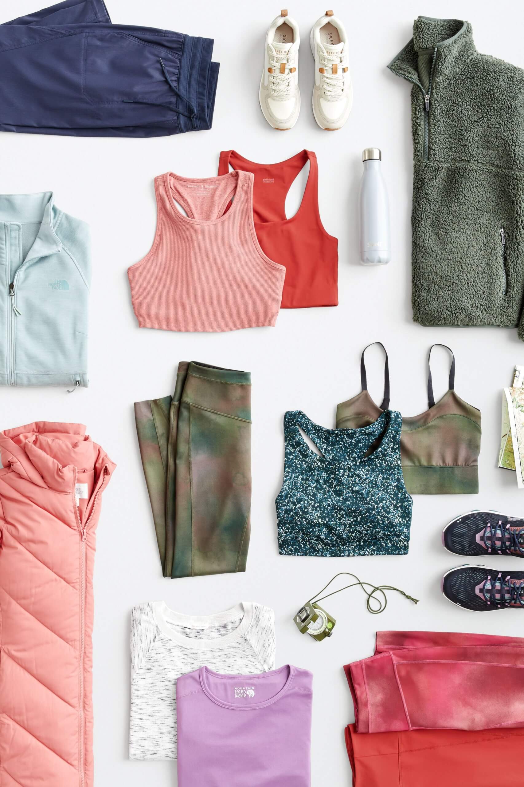 Stitch Fix women’s hiking attire in various colors and prints including sports bras, quarter zips, leggings, joggers, T-shirts and sneakers.