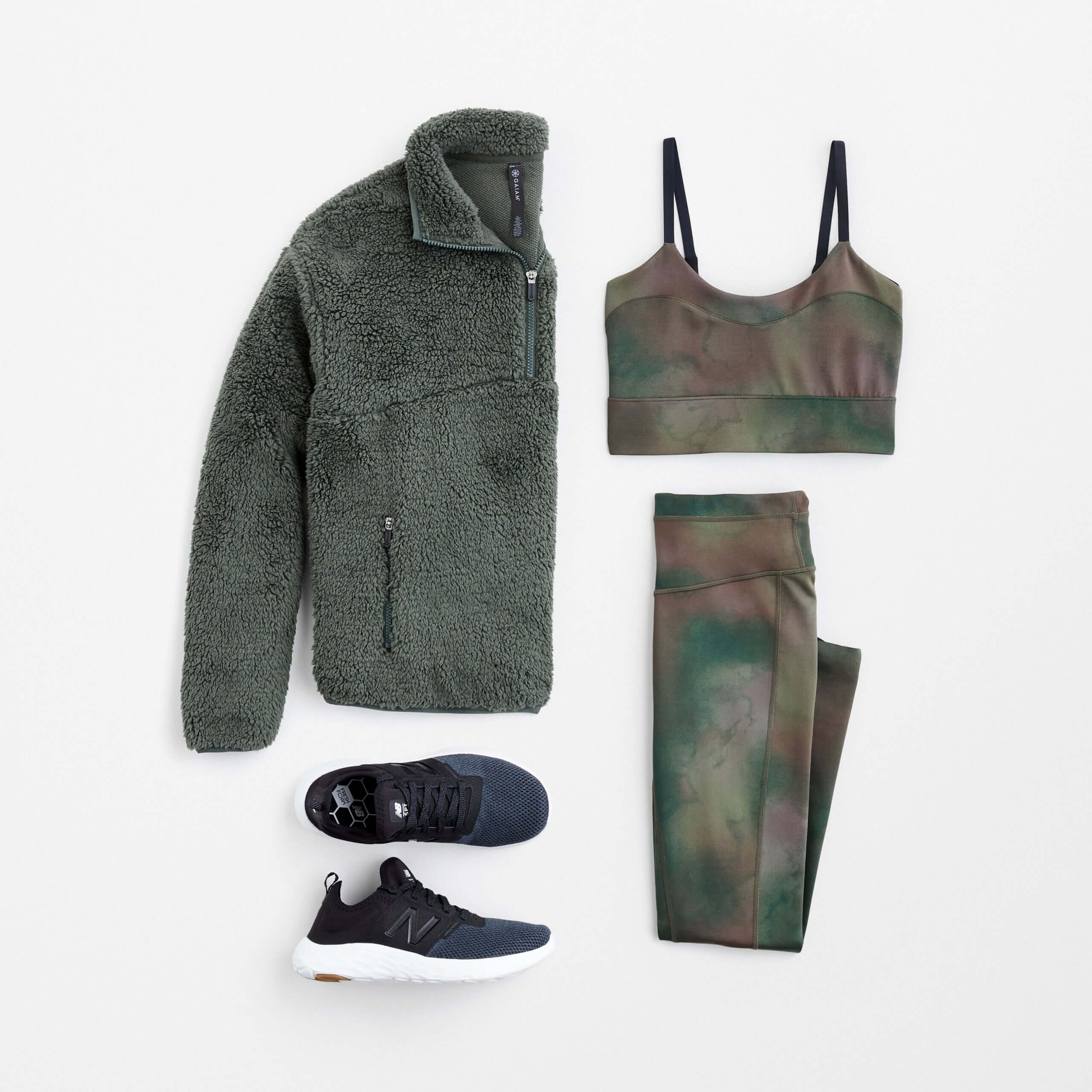 Stitch Fix women’s hiking outfit with patterned sports bra and matching leggings, dark green wubby quarter-zip and sneakers.