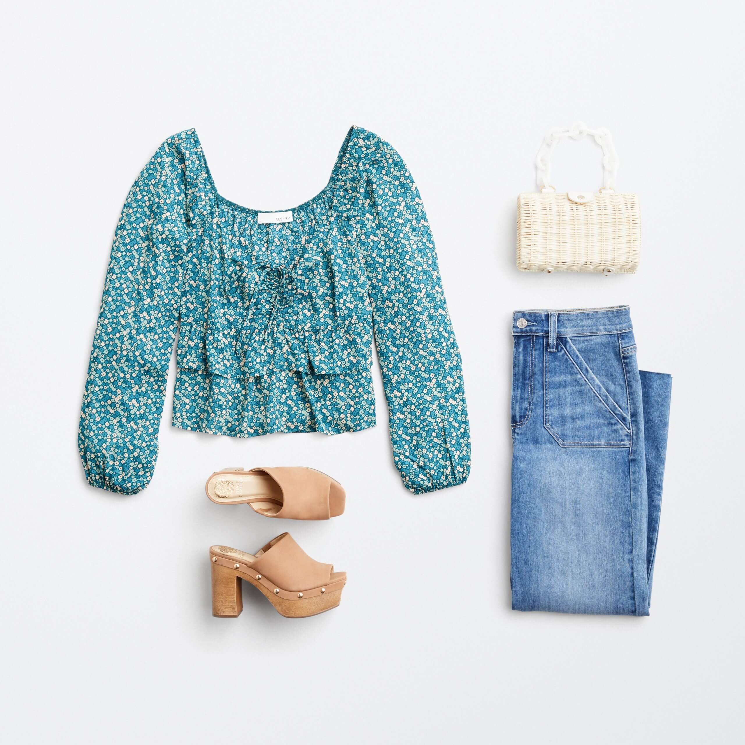 Stitch Fix women’s outfit featuring green floral blouse, off-white clutch, blue utility jeans and tan slide heels.