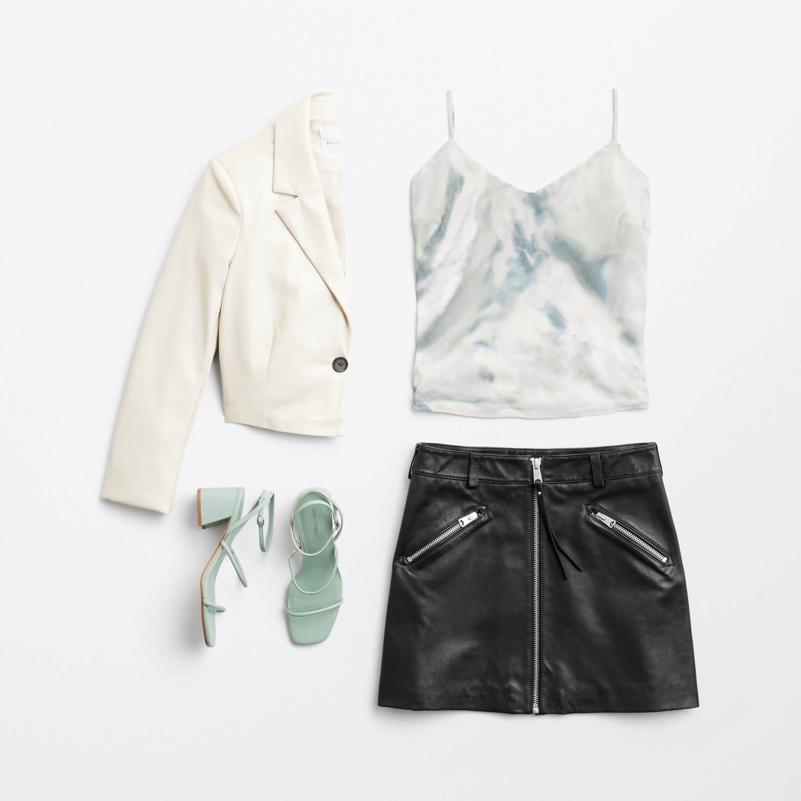 Stitch Fix women’s miniskirt outfit featuring black faux leather skirt, tie-dye camisole, white blazer and mint heels.