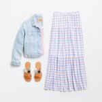 Stitch Fix women's picnic outfit with purple and white gingham maxi skirt, pink tank, denim jacket, tan and silver sandals.