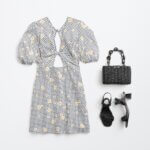 Stitch Fix women's Y2K fashion outfit with black and white gingham floral dress, woven black bag and black strappy heels.